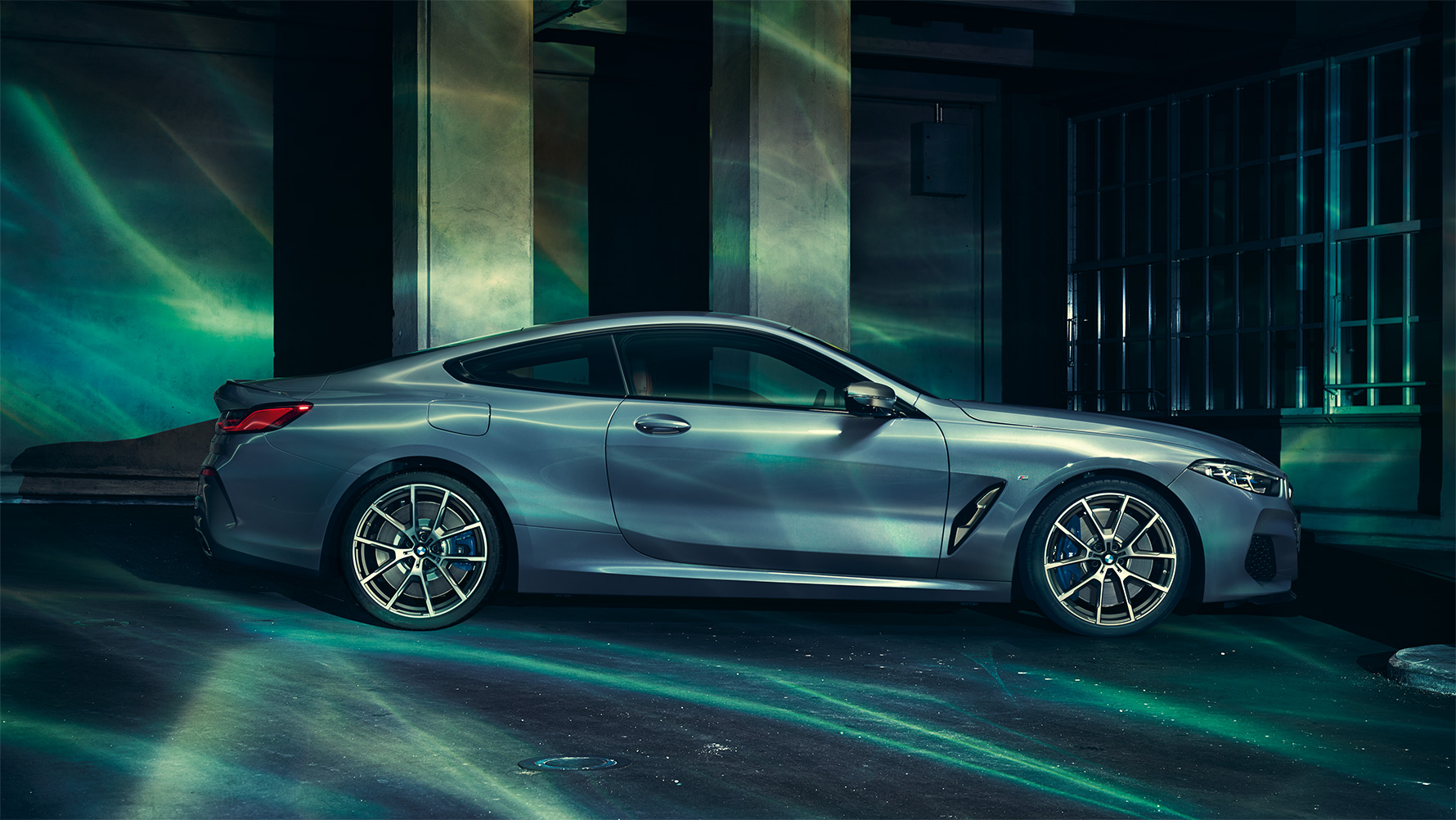 The BMW 8 Series, side view A still shot of the BMW 8 Series Coupé from the side in an urban setting.