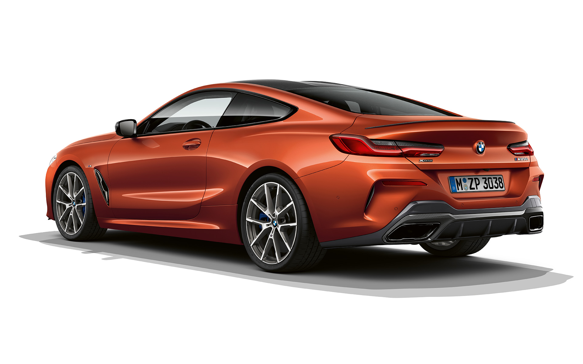 BMW 8 Series Coupé, Sunset Orange metallic A still shot of the BMW 8 Series Coupé in Sunset Orange metallic against a white background.