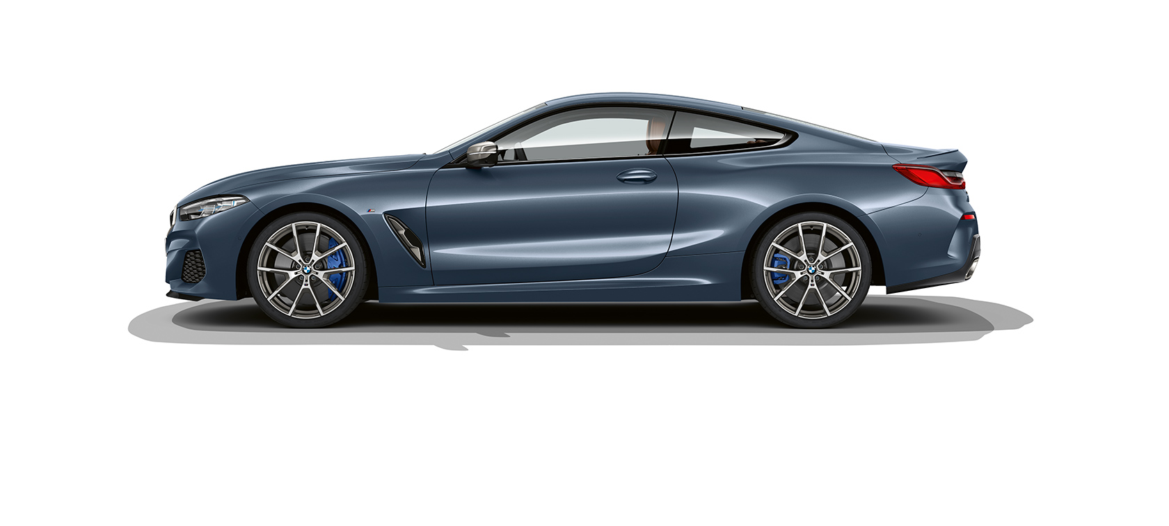 Still shot of the BMW 8 Series Coupé and M8 GTE. Still shot of the BMW 8 Series Coupé and M8 GTE in an urban area at night.