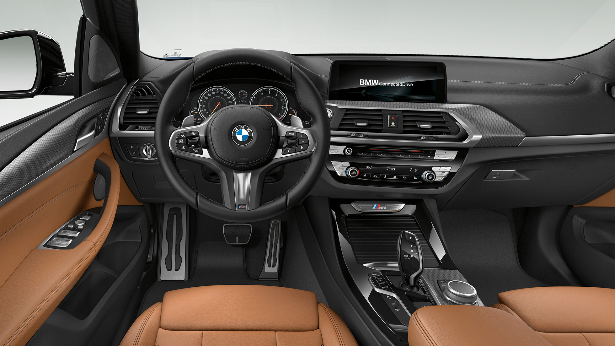 BMW X3 M40d, posto de condução. BMW X3 M40d, interior, posto de condução com volante M em pele e bancos desportivos M.