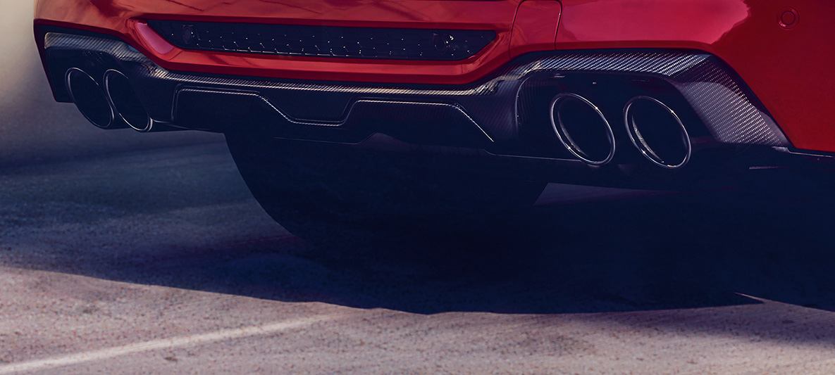 BMW X4 M Competition, difusor traseiro em carbono. BMW X4 M Competition na pintura vermelho Toronto metalizada, exterior, pack exterior M em carbono, difusor traseiro em carbono.