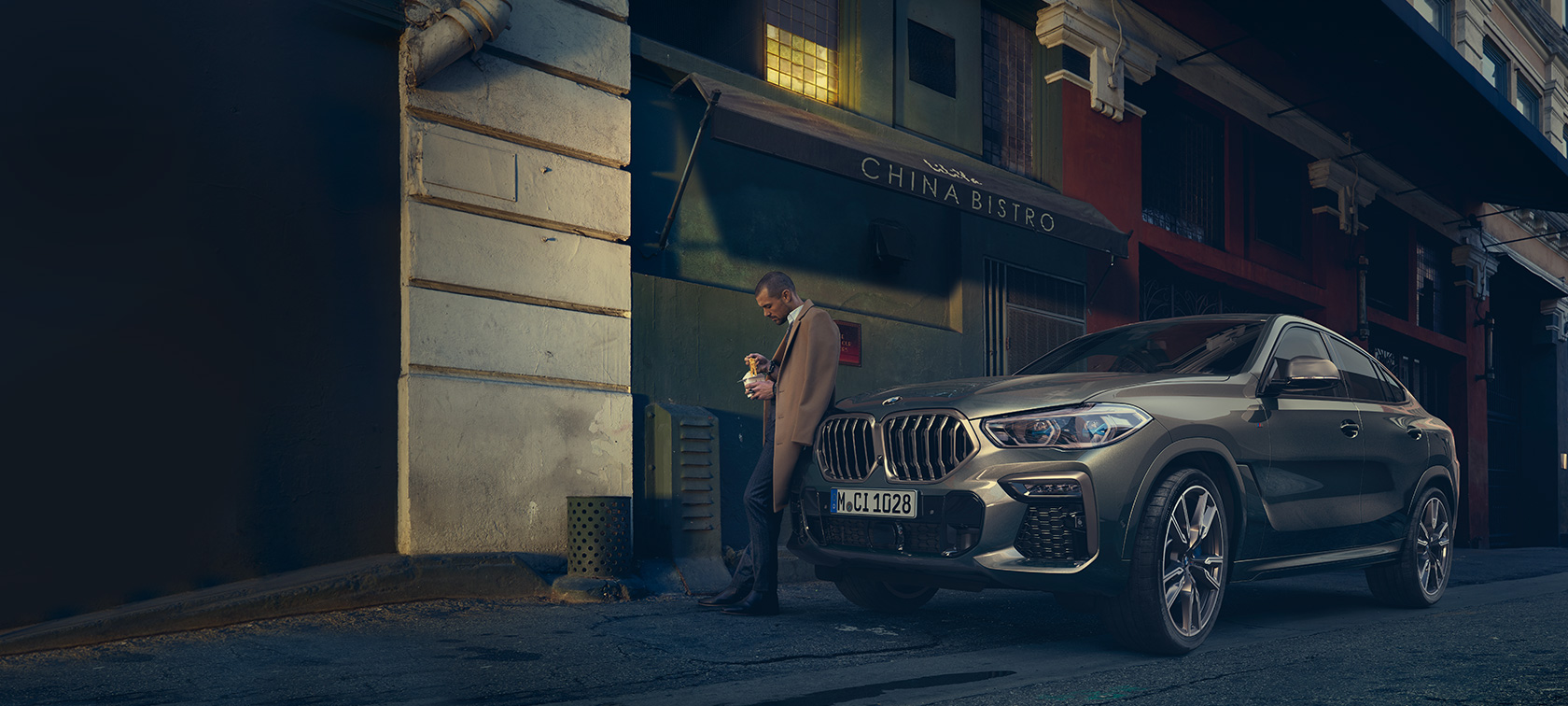 BMW X6, perspetiva traseira a três quartos, em movimento BMW X6, G06, 2019, pintura Manhattan metalizada, perspetiva traseira a três quartos